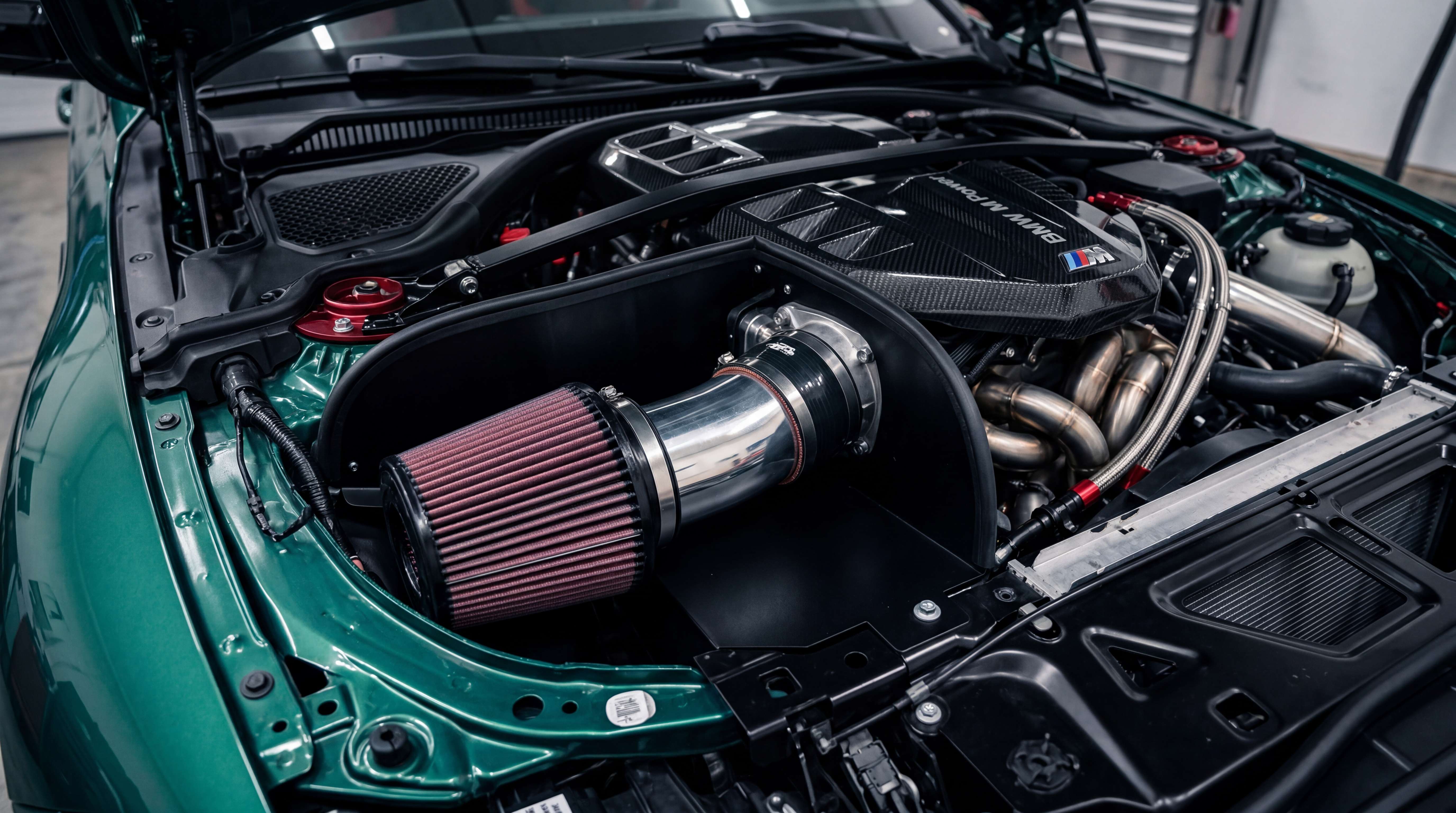 High performance cold air intake installed in an engine bay with cone filter, aluminum intake pipe and heat shield